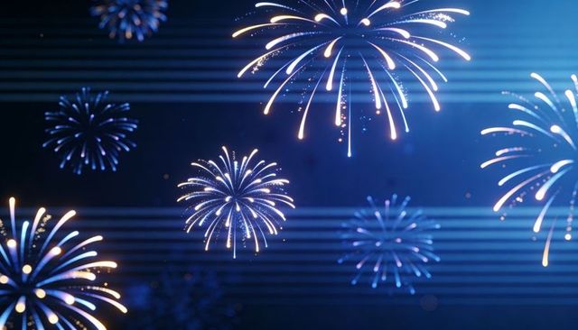 Festive blue fireworks bursting across night sky with radiant trails and sparkling bokeh