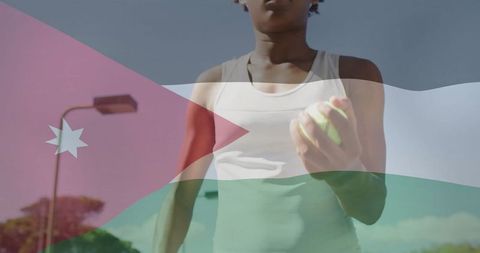 Focused Tennis Player Holding Ball on a Sunny Court