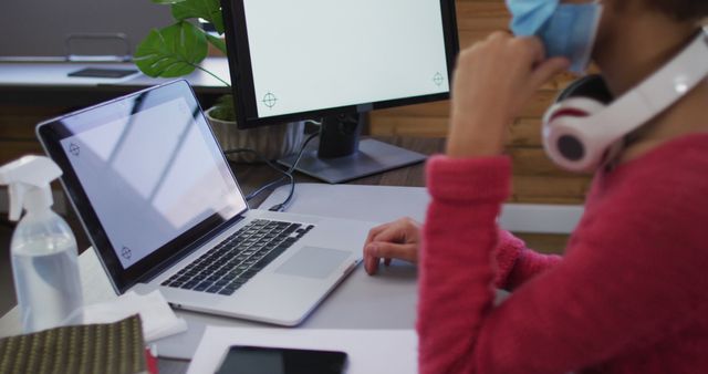 Person Working from Home during Pandemic Using Laptop and Desktop - Download Free Stock Images Pikwizard.com