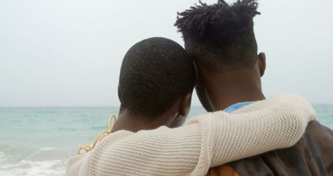 Couple Embracing on Beach Showing Bond and Togetherness - Download Free Stock Images Pikwizard.com