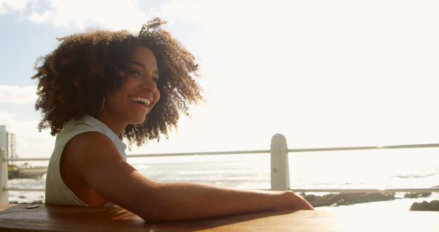 Relaxed Woman Enjoying Sunshine on Coastal Promenade - Download Free Stock Images Pikwizard.com