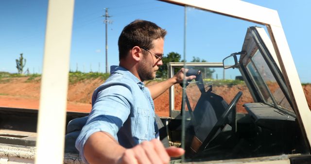 Man Driving Off-Road Vehicle on Sunny Day - Download Free Stock Images Pikwizard.com