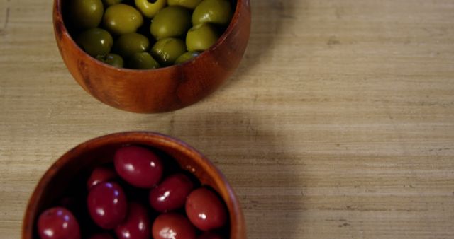 Wooden Bowls with Green and Purple Olives on Wooden Surface - Download Free Stock Images Pikwizard.com