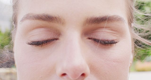Close up image portrait of eyes of caucasian woman smiling outdoors. Health, happiness, relaxation and lifestyle concept.