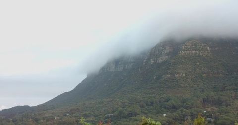 Misty Mountain With Cloud-Covered Limestone Cliffs