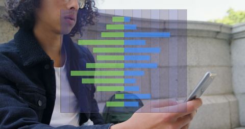 Young Adult Analyzing Data on Smartphone Outdoors