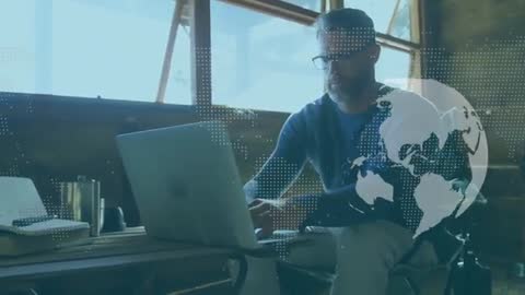 Professional Analyzing Global Data on Laptop in Modern Workspace