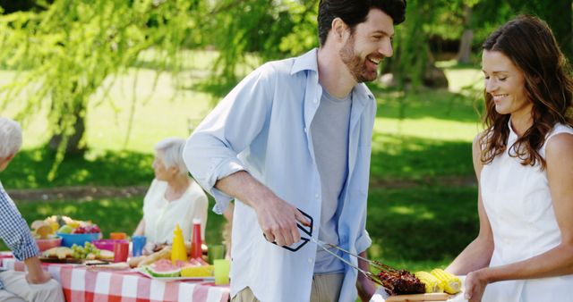 Family Picnic in Park with Barbecue and Greenery - Download Free Stock Images Pikwizard.com