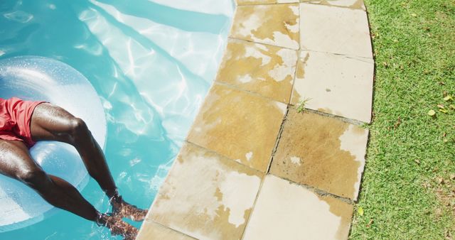 Person Relaxing by the Pool on a Sunny Day - Download Free Stock Images Pikwizard.com