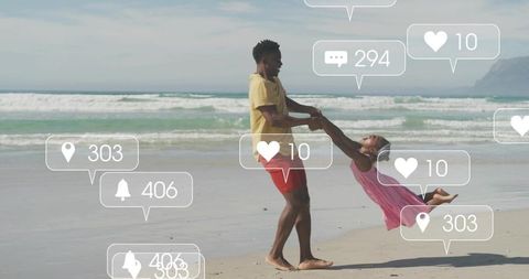 Father swinging daughter on sandy beach with social media notification overlays