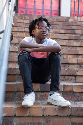 Urban Youth in Contemplative Mood on Brick Steps