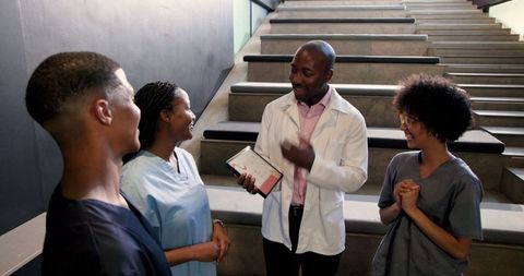 Diverse Healthcare Team Celebrating Success with Certificate