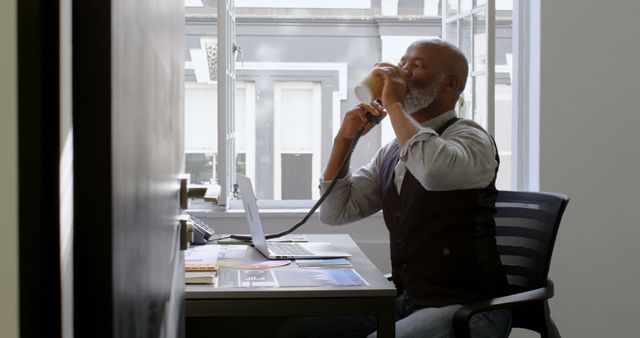 Senior Businessman Drinking Coffee and Working in Modern Office - Download Free Stock Images Pikwizard.com