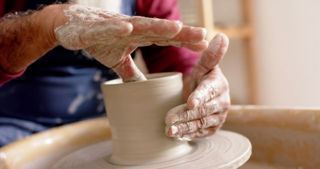 Hands Shaping Clay on Pottery Wheel in Workshop - Download Free Stock Images Pikwizard.com