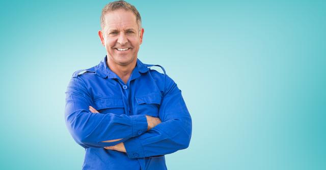Middle-aged serviceman wearing blue uniform with arms crossed and smiling against a turquoise background. Ideal for advertisements, recruitment posters, service-related promotions, and corporate materials.