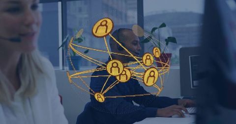 Typing call center agent wearing headset with golden global network overlay
