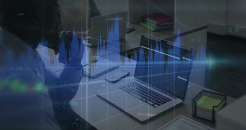 Colleagues analyzing financial charts on laptop with overlaid data visuals for teamwork