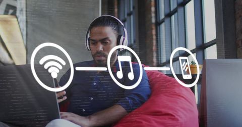 Man using smartphone with digital network graphics overlay