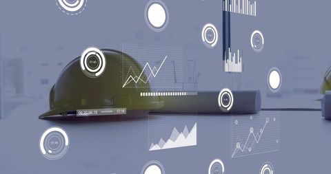 Yellow hard hat resting on planning table with rolled blueprints and digital hud overlays