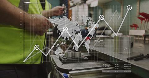 Industrial technician analyzing machine components with digital data overlay