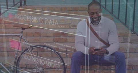 Smiling man using smartphone on brick steps with bicycle and digital data overlay