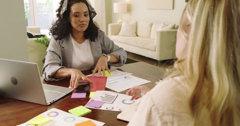 Diverse Colleagues Collaborating on Strategy in Home Office Setting