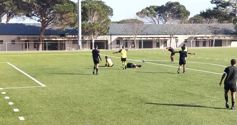Youth soccer match showcasing teamwork and sportsmanship
