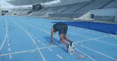 Male Sprinter Launching at Stadium Start