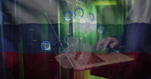 Typing hands operating laptop with holographic flag and futuristic data analytics overlay