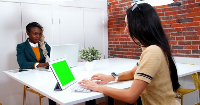 Diverse Businesswomen Working on Laptops at Modern Office Desk - Download Free Stock Images Pikwizard.com