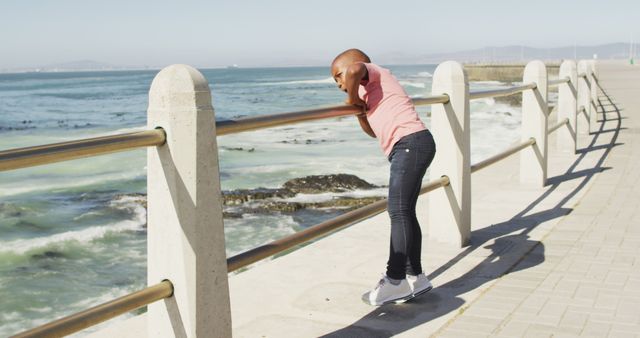 Child Leaning Against Seaside Railing on Sunny Day - Download Free Stock Images Pikwizard.com