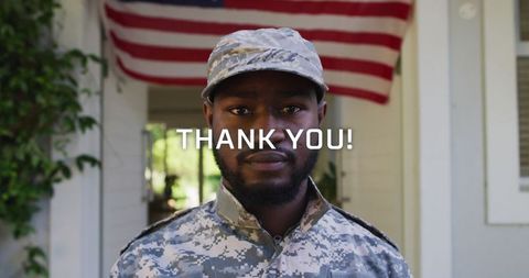 Proud African American Soldier Standing in Front of USA Flag
