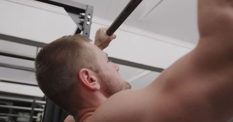 Close-Up of Athletic Man Performing Chin-Ups in Gym