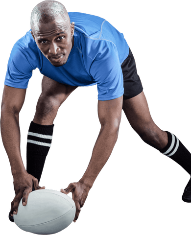Rugby player in blue preparing for game action on transparent background