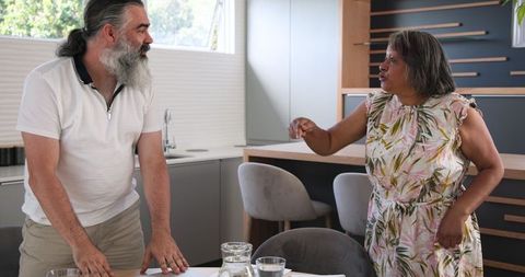Senior Couple Enjoying Technology and Laughter at Home