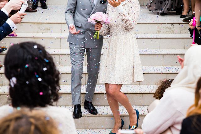 Bride and Groom Celebrating Marriage with Confetti on Stairs - Download Free Stock Photos Pikwizard.com