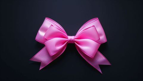 Elegantly Crafted Pink Satin Bow on Dark Background