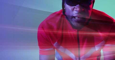 Energetic Cyclist Riding in Dynamic Studio Setting with Motion Effect