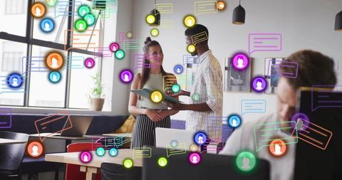 Young professionals collaborating in modern coworking space with colorful chat overlays
