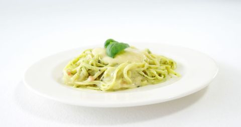 Creamy Basil Pasta on White Plate with Copy Space - Download Free Stock Images Pikwizard.com