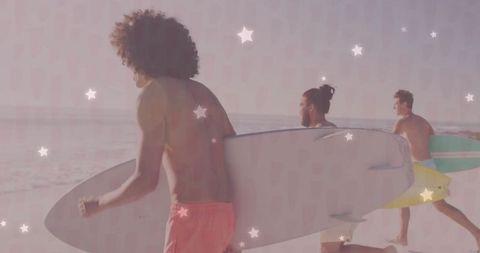 Men Carrying Surfboards Running on Beach at Sunset