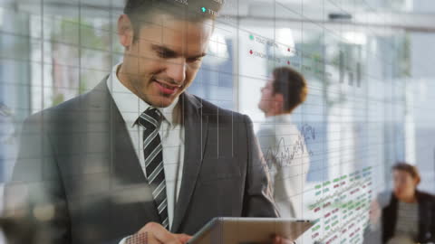 Caucasian Businessman Analyzing Stock Market Data on Tablet