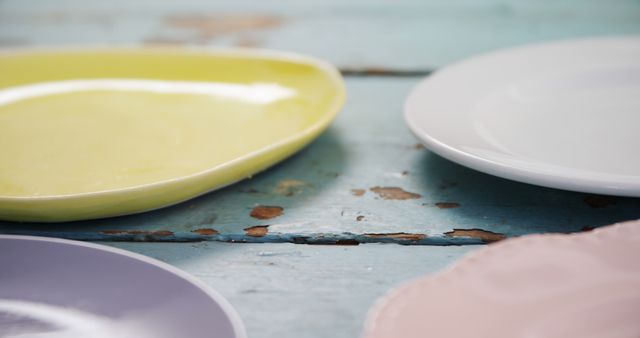 Close-up of Colorful Ceramic Plates on Rustic Wooden Table - Download Free Stock Images Pikwizard.com