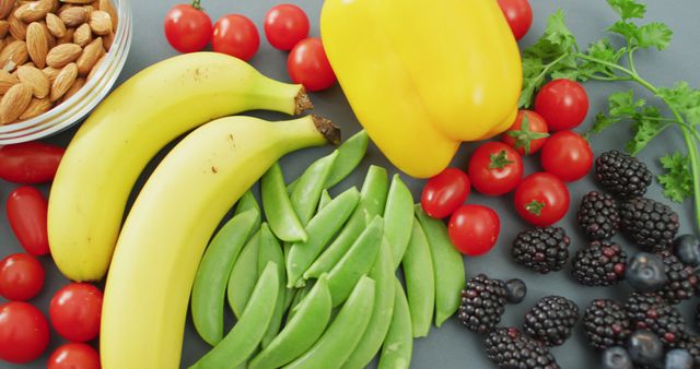 Healthy assortment of fresh fruits and vegetables on gray background - Download Free Stock Images Pikwizard.com