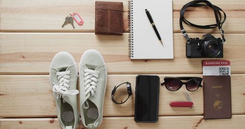 Traveler Essentials: Shoes, Camera, Boarding Pass and Passport on Wooden Table - Download Free Stock Images Pikwizard.com