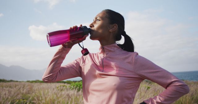 Active Woman Drinking Water from Sports Bottle Outdoors - Download Free Stock Images Pikwizard.com