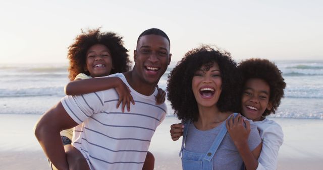 Portrait of african american family smiling together at the beach. family travel vacation leisure concept