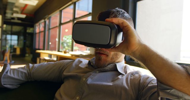 Businessman Relaxing with Virtual Reality Headset in Modern Office - Download Free Stock Images Pikwizard.com