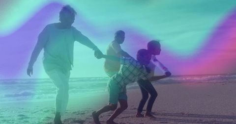Carefree Family Enjoying Beach Together in Sunset Glow