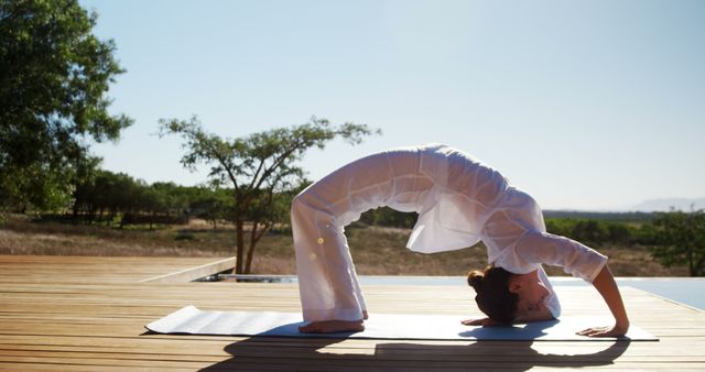 Woman Practicing Yoga Wheel Pose Outdoors on Sunny Day - Download Free Stock Images Pikwizard.com